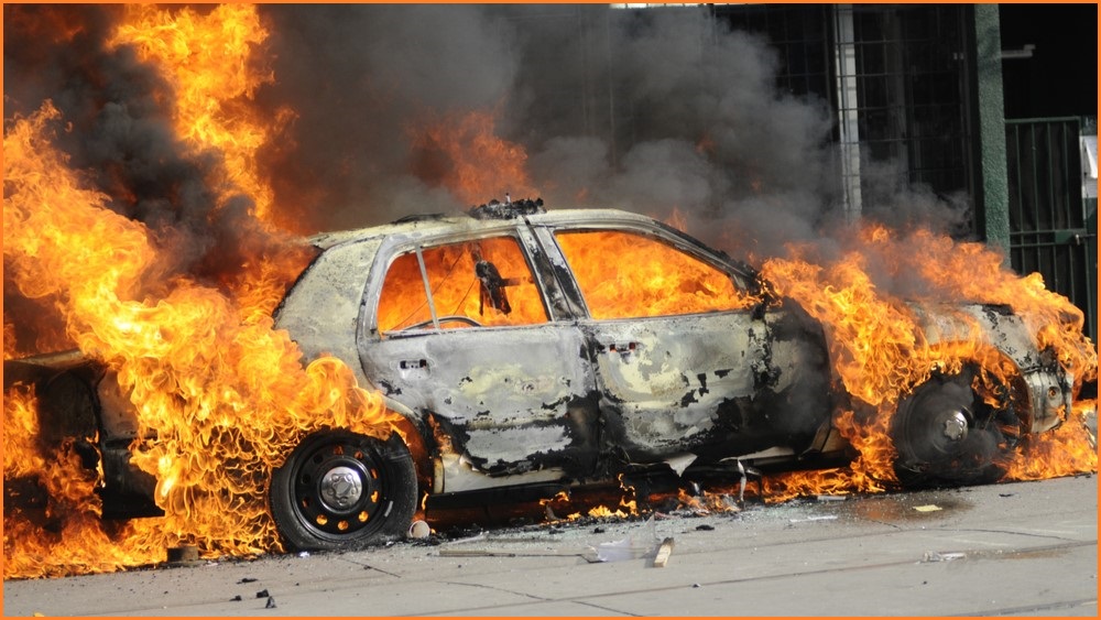 Burning car engulfed in flames
