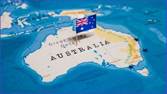 Map of Australia with an Australian flag planted in the centre
