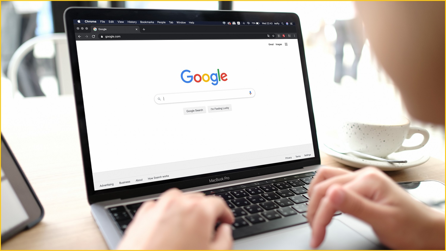 A person using Google search on their laptop.