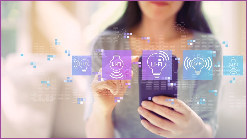 A woman holding a phone with purple and blue Li-Fi icons floating in front of it.