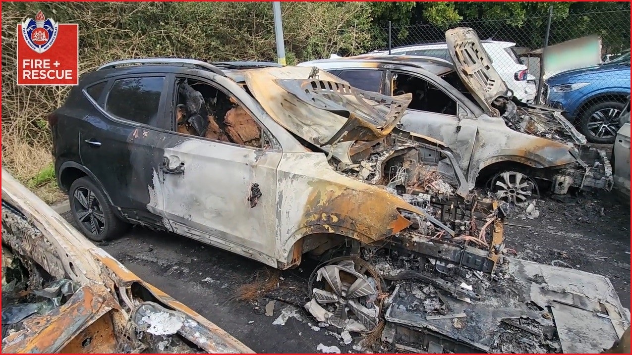 A burned car in the airport parking lot