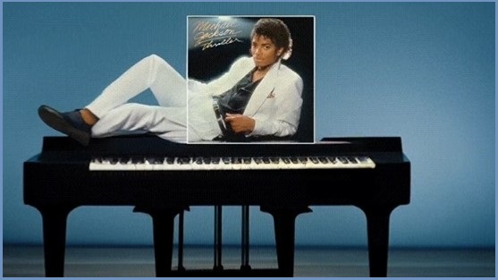 Michael Jackson Thriller album cover expanded to show him lying on a piano top