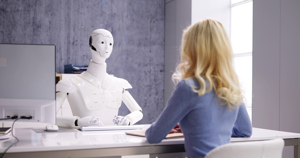 Robot interviewing woman for job
