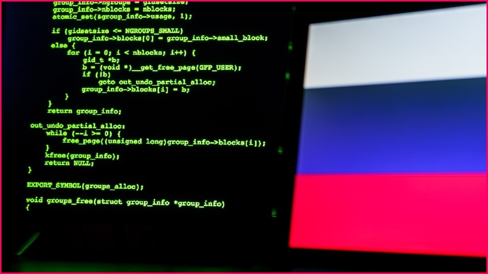 HTML code and the Russian flag on a computer screen