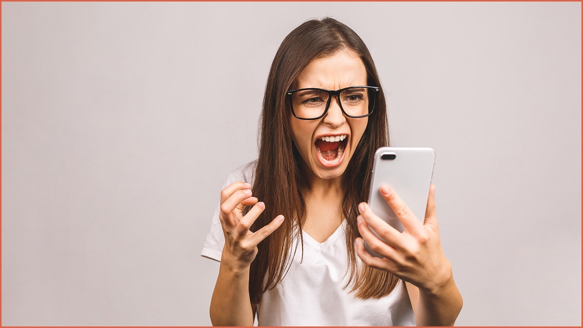 A woman screaming at her phone.