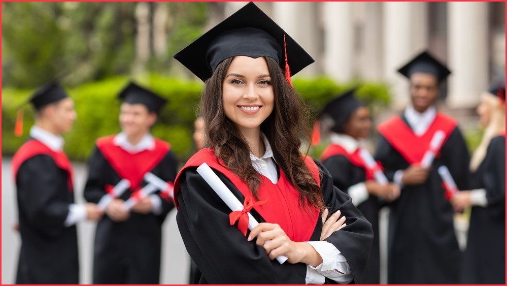woman holding degree with other people holding degrees in the background
