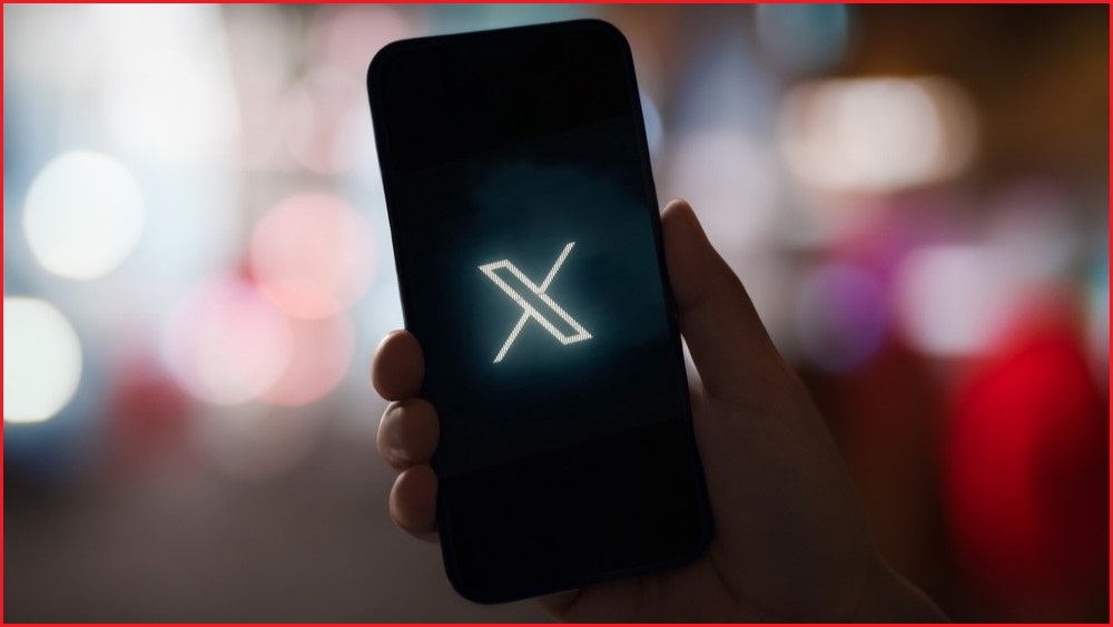 Phone screen showing the X logo