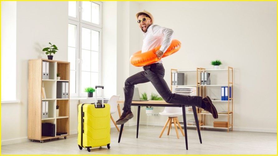 Man with holiday gear celebrating in the office