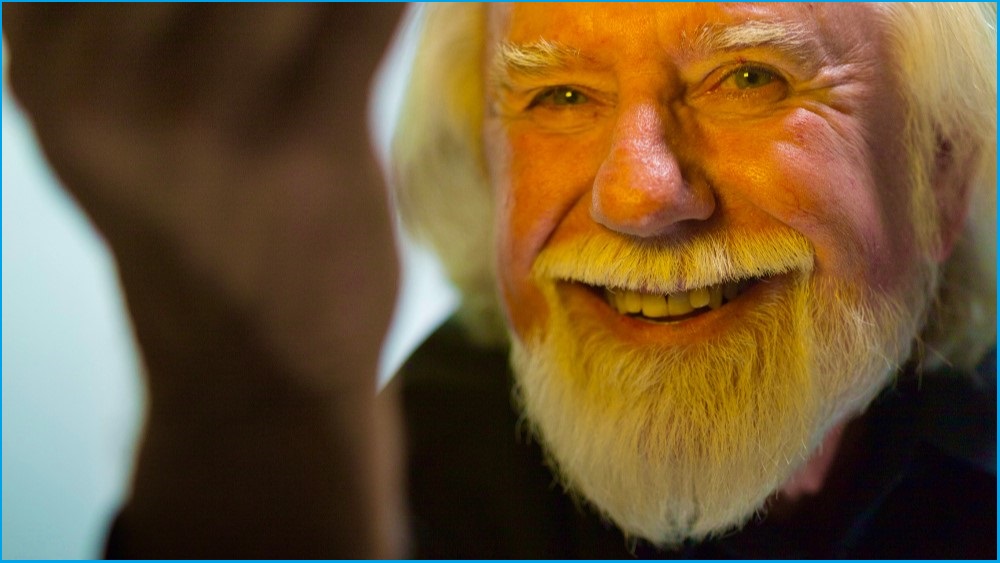 A close up of Alvy Ray Smith, an elderly man with a beard, smiling.