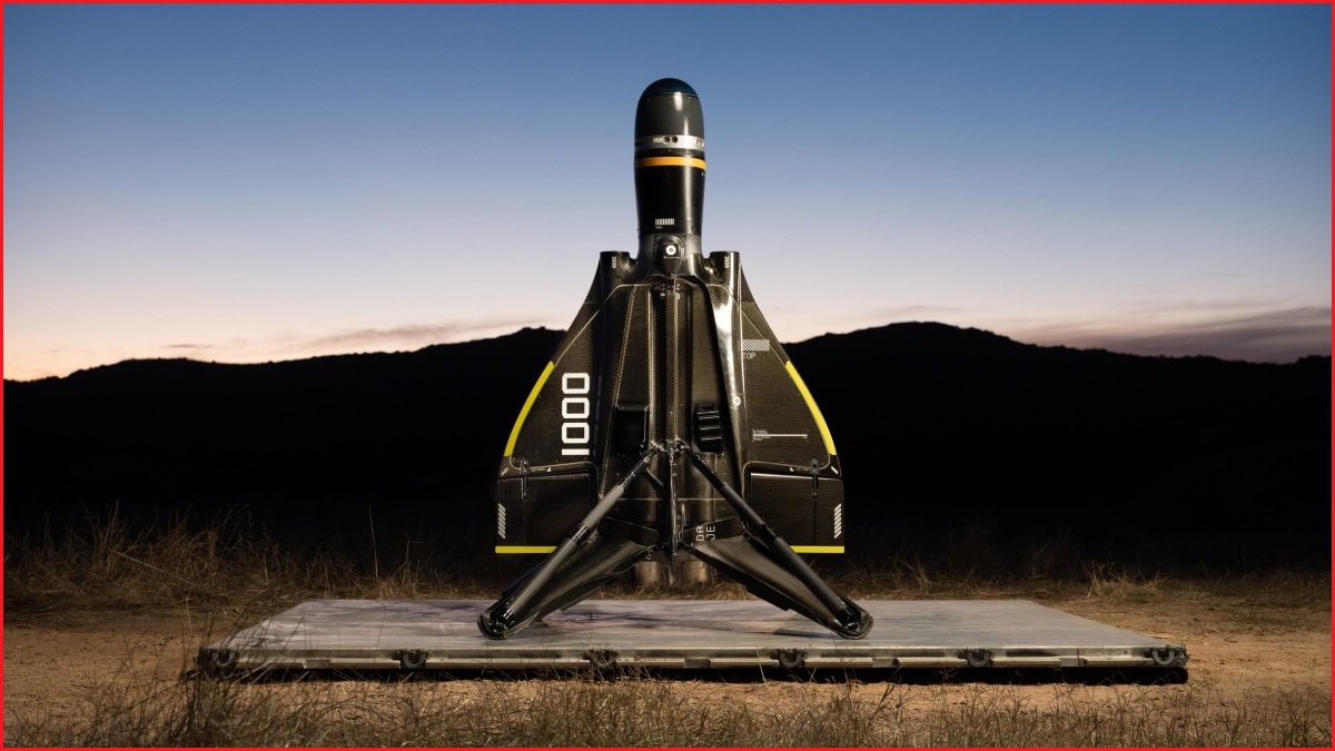 A close up of a military anti-drone device, sitting on a launchpad in a desert at dusk.