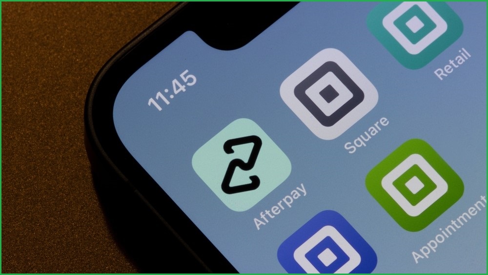 A close up of a smartphone screen showing buy now pay later apps from Afterpay and Square.