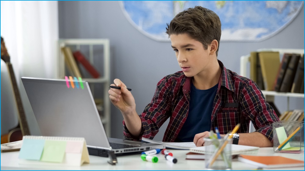 Teenager using a computer