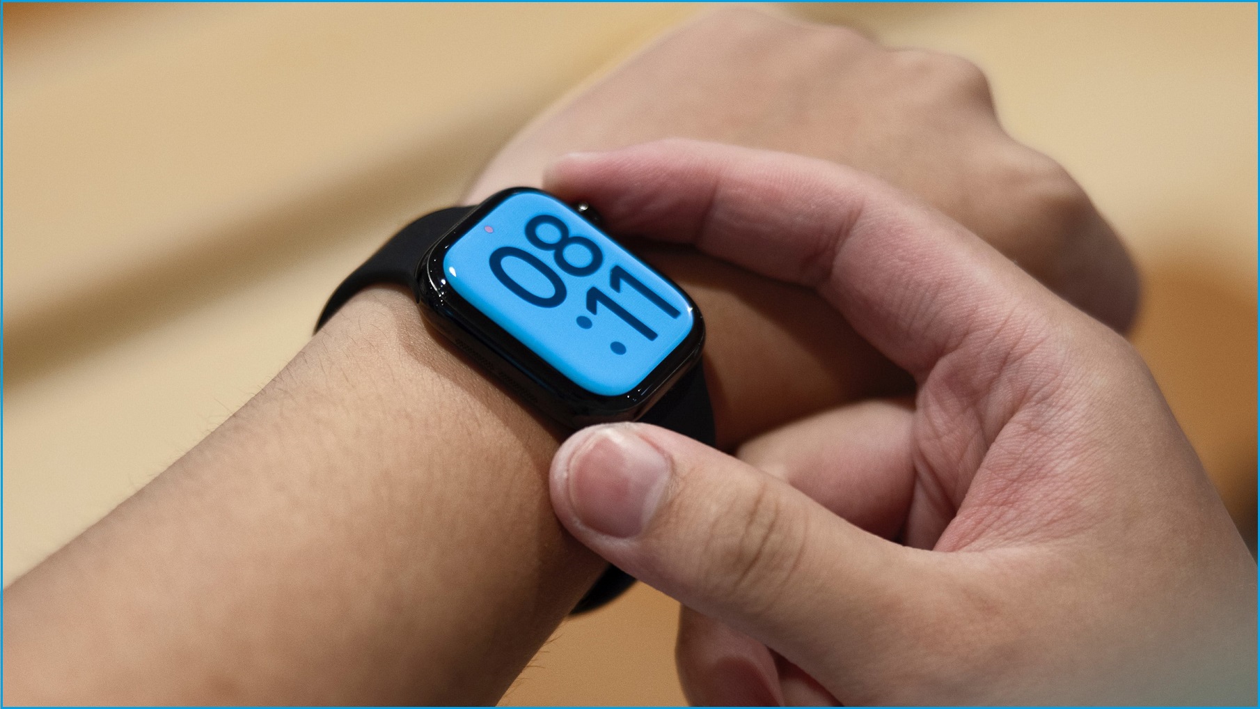 A close up of a person's hand operating an Apple Watch on their wrist.