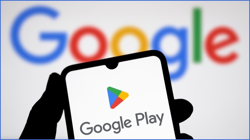 Google Play logo on a phone screen with a google logo in the background.