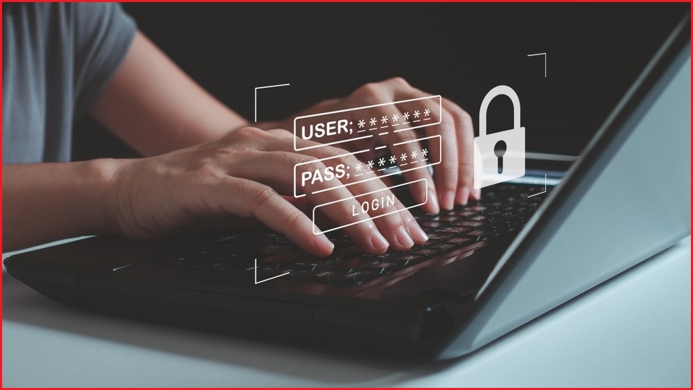 A close up of hands typing on a laptop keyboard, above which is superimposed a computer window to input a user name and password.