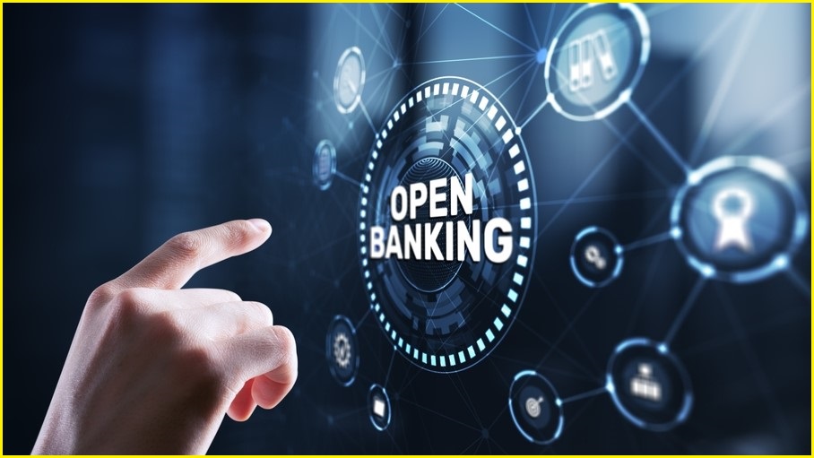 Finger about to touch a screen that says 'Open Banking'.