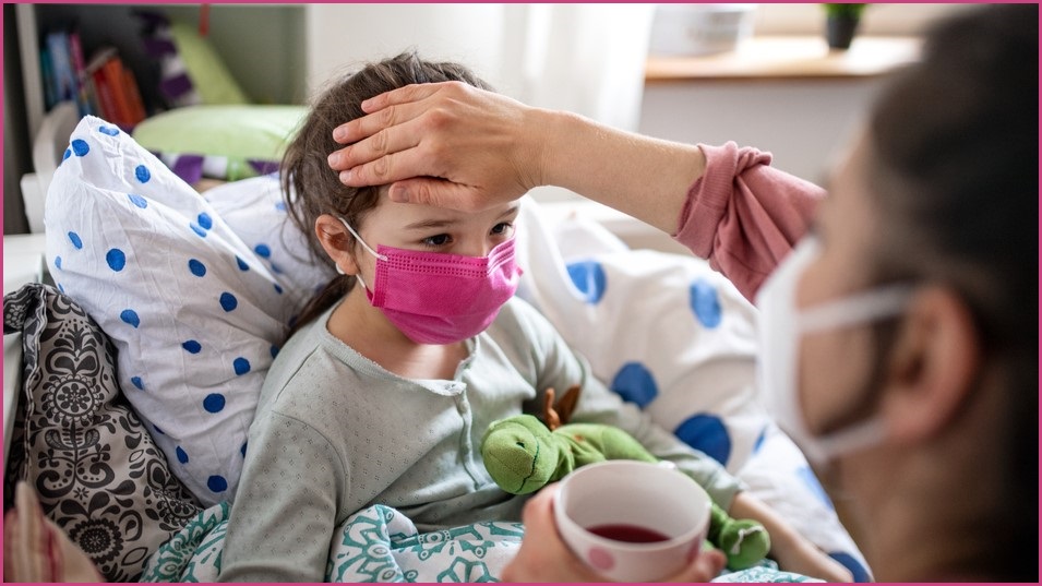 Woman looking after sick child.