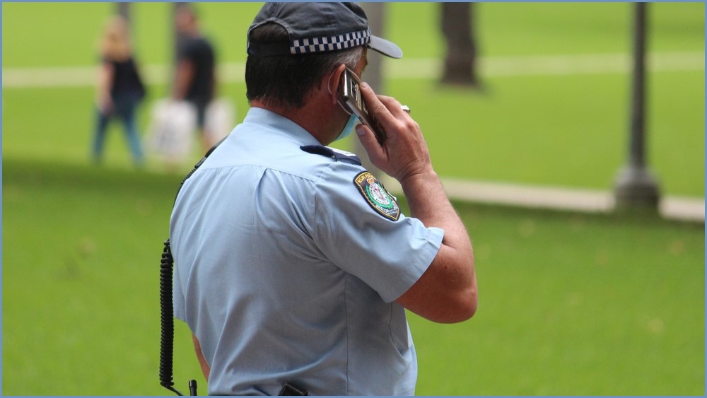 NSW Police officer on the phone.