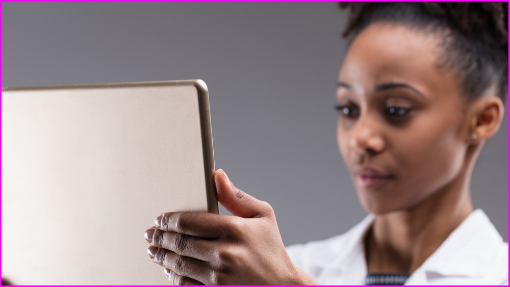 Science woman holding iPad.