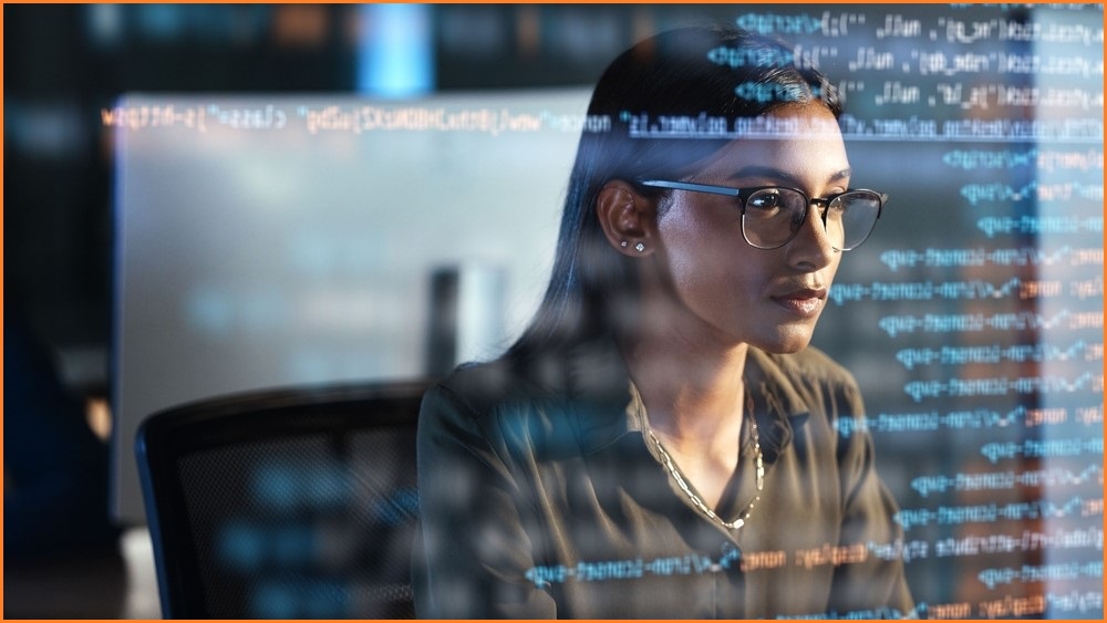 Woman working at a computer.