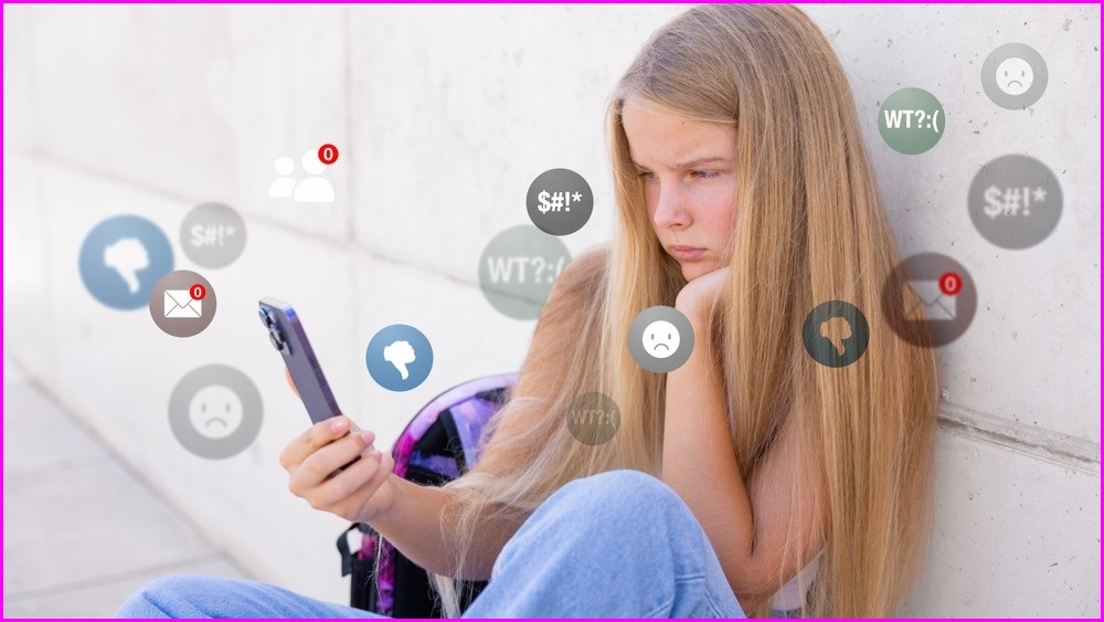 Young depressed girl looking at social media.