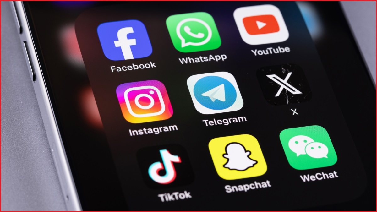 A close up of a smartphone display showing nine app icons for major social media platforms, including Facebook, Instagram, TikTok, YouTube.