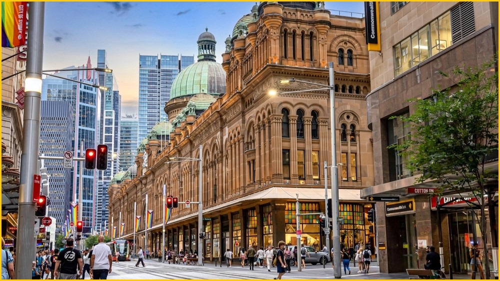 Photo of Queen Victoria Building in Sydney with people walking around.