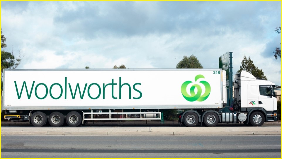 Large truck with Woolies logo on the side.