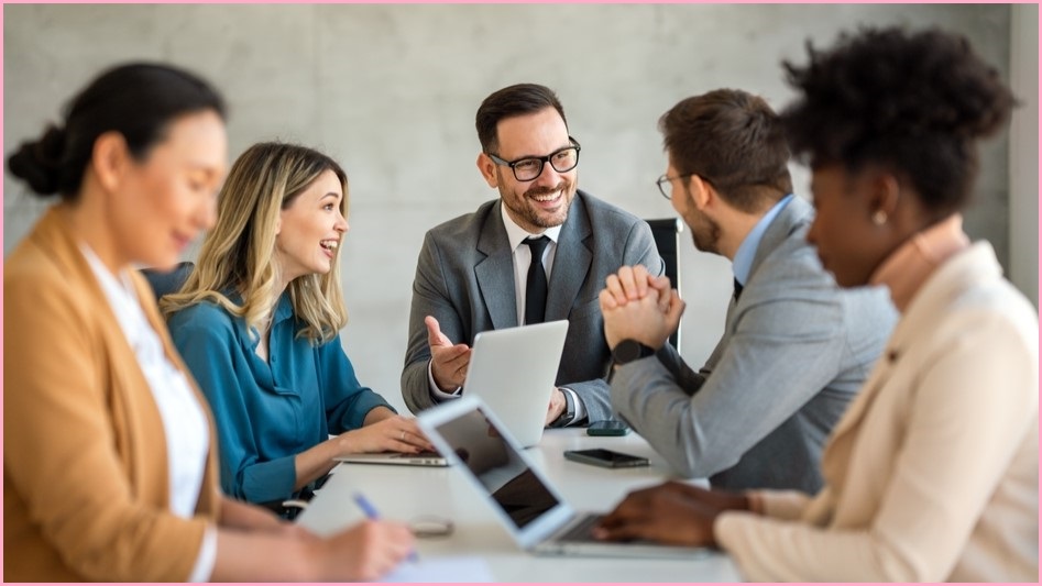 Group sitting around a table in an office.