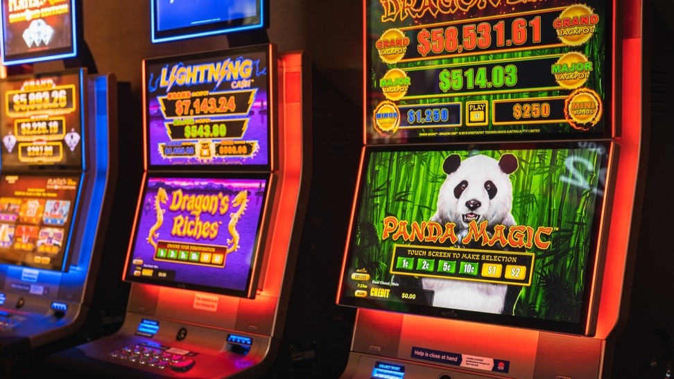 A row of three gaming machines.