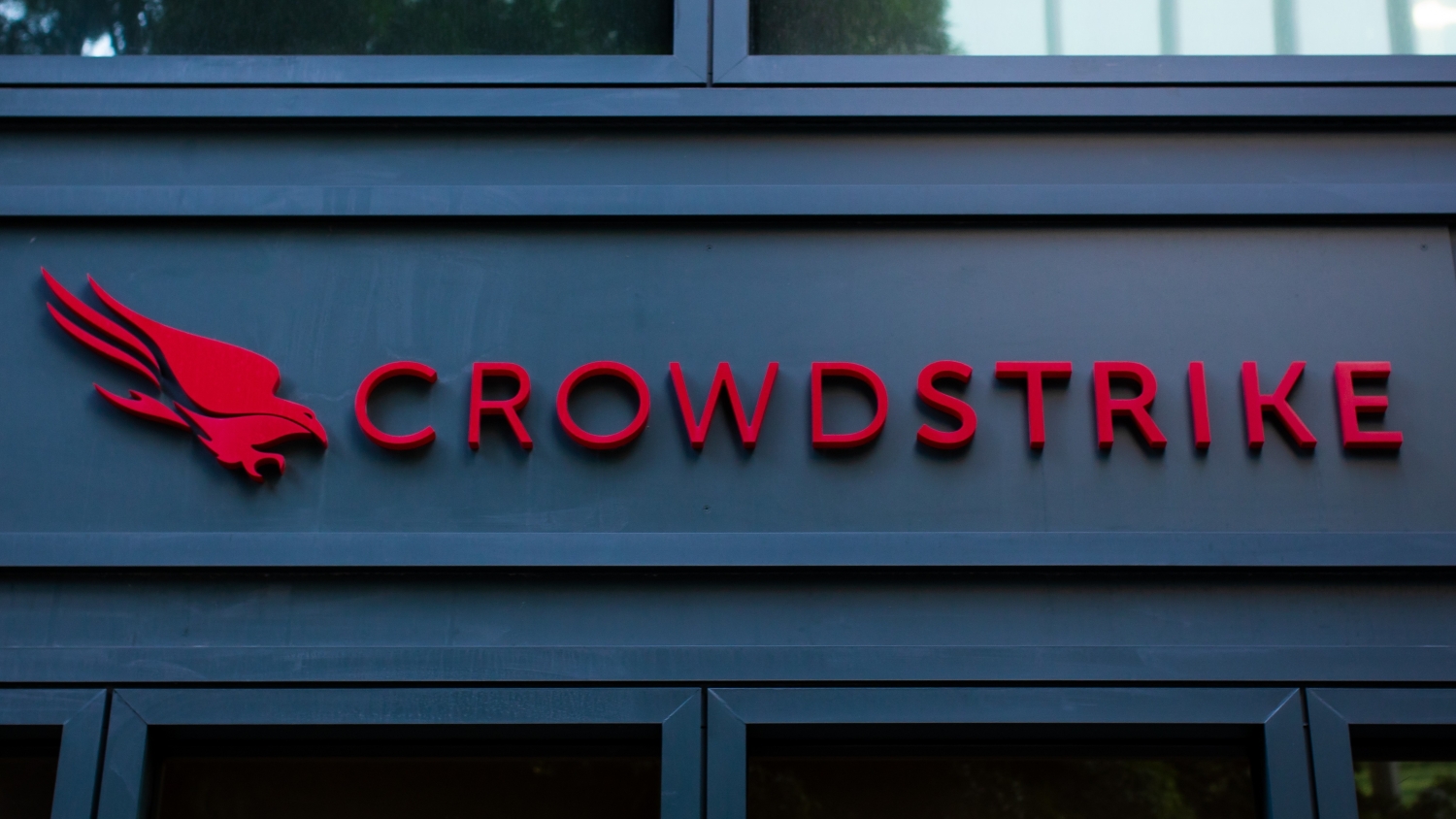 A close up of the CrowdStrike logo on the front of an office building.