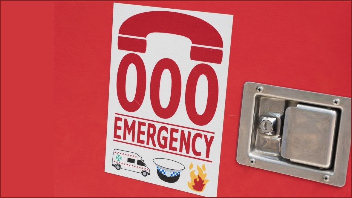Emergency services signage on side of vehicle.