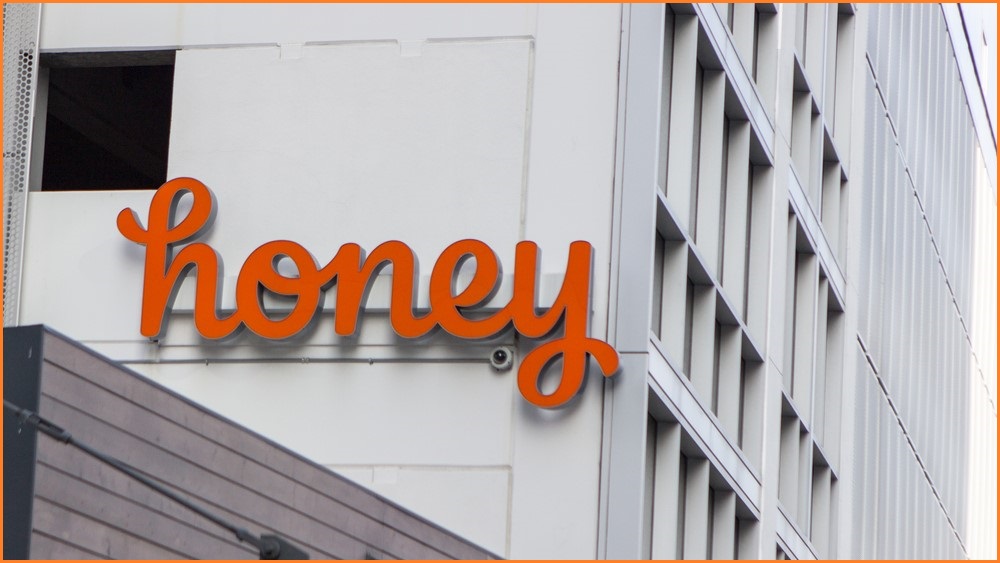 A medium shot of the Honey logo on the side of an office building.