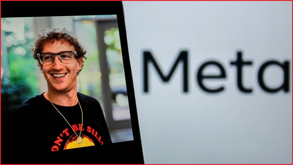 A close up of a phone displaying a photo of Mark Zuckerberg smiling, next to an image of the Meta logo.