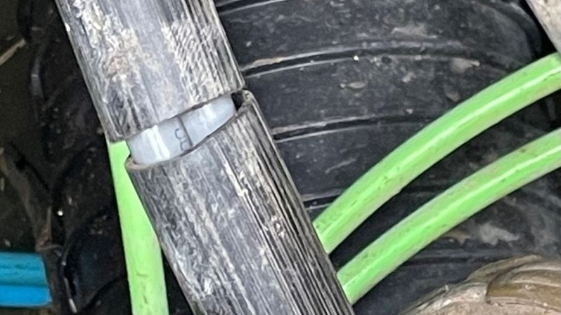 Black cable cut in half.