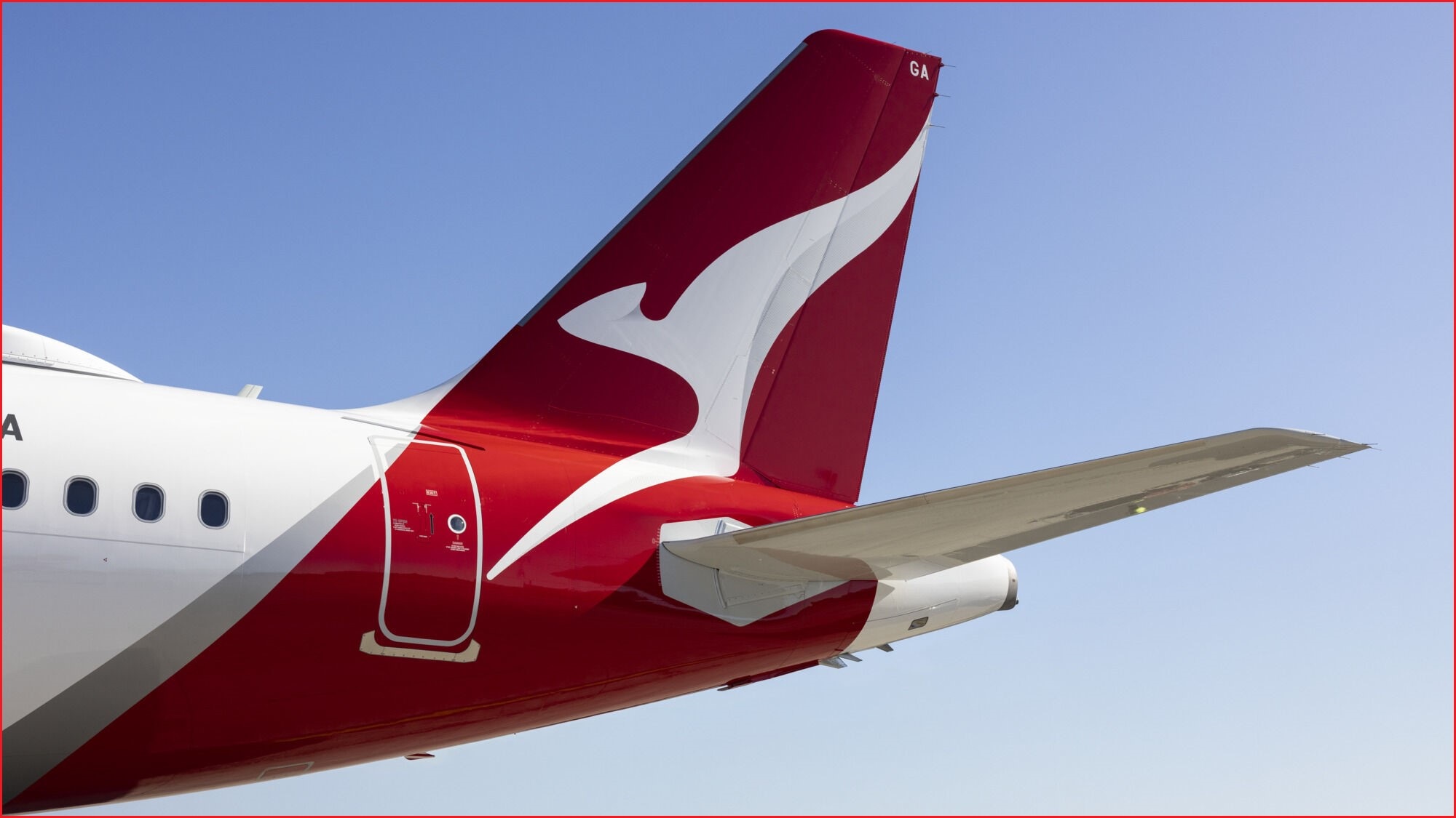 A close up of the tail of a Qantas plane, with its famous Kangaroo logo.