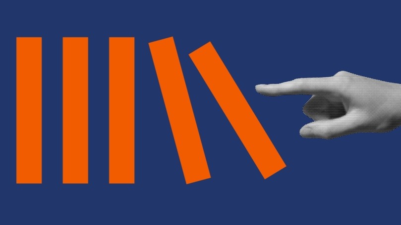 A finger pushing over a rod which then pushes over the next one.