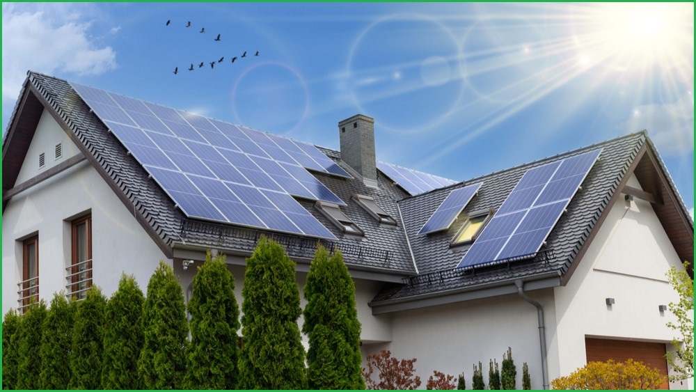 Sun shining on rooftop solar panels.
