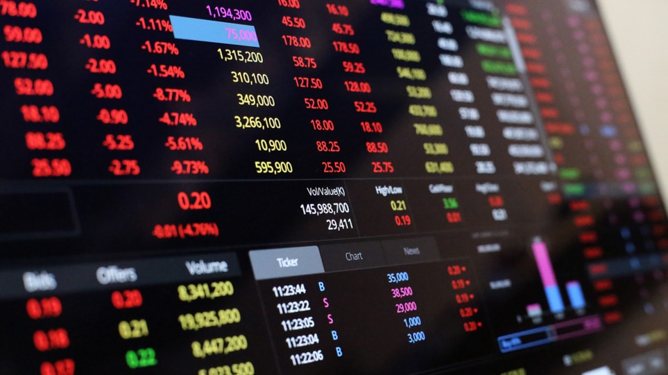An electronic board showing share prices.