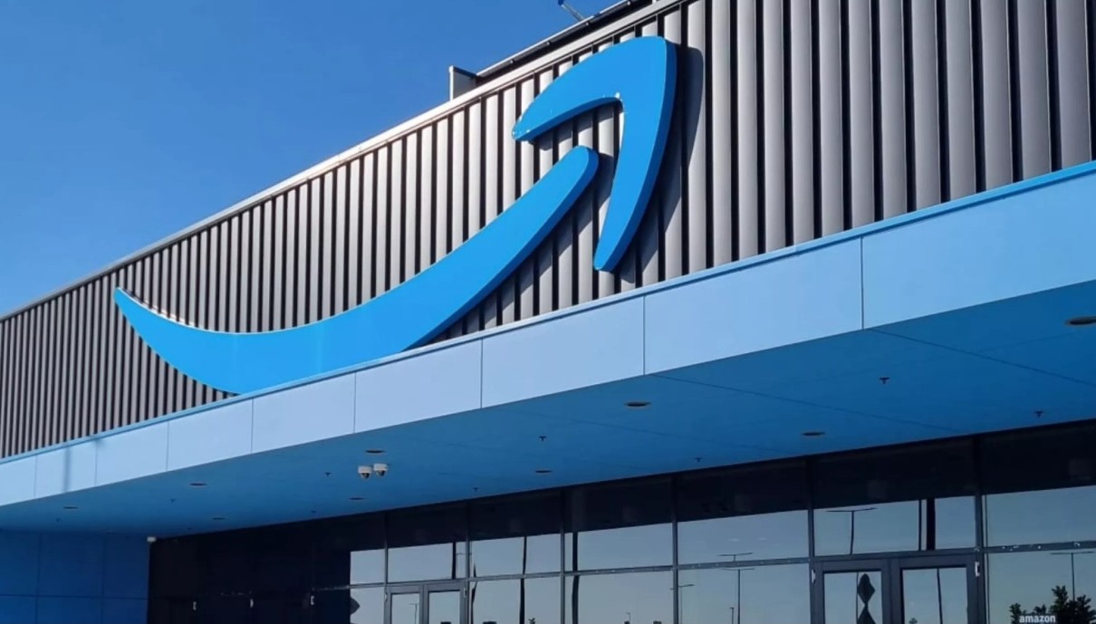 Amazon blue arrow signage on building.