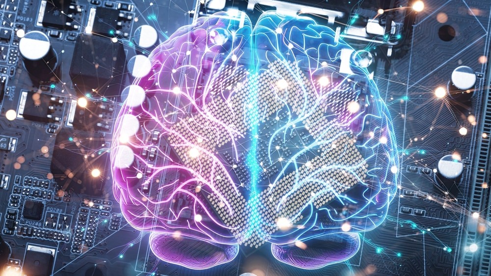 Image of a brain imposed on a motherboard.