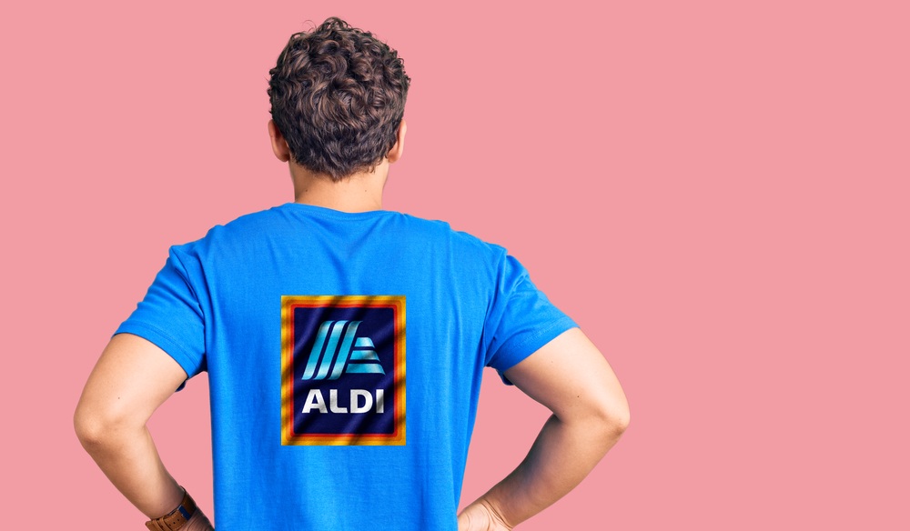 Behind shot of male worker wearing Aldi t-shirt.