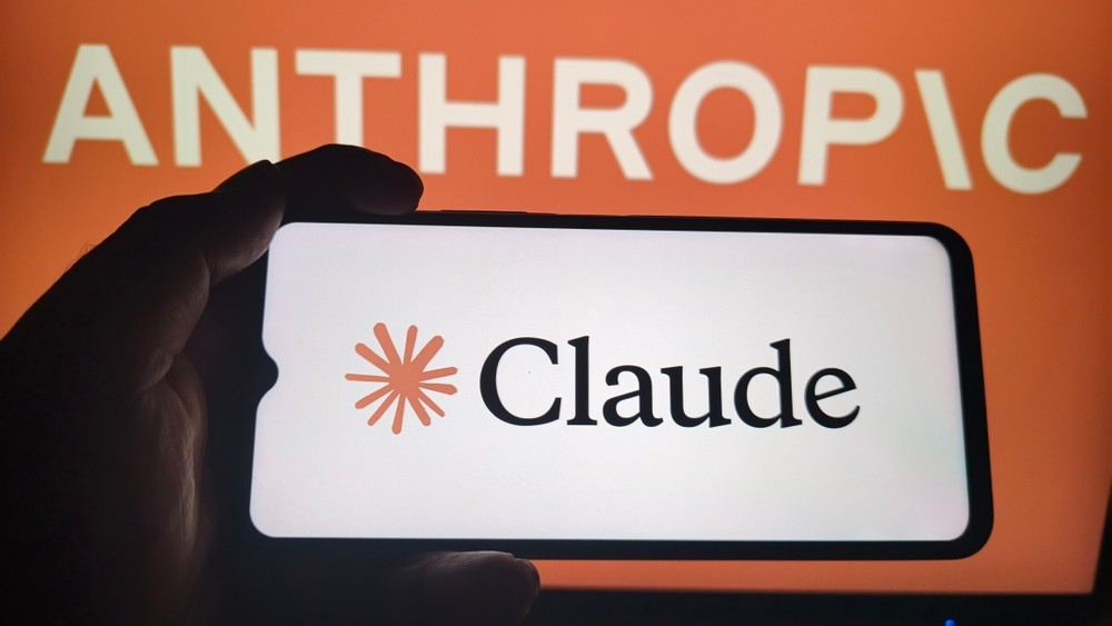 Claude logo on phone screen.