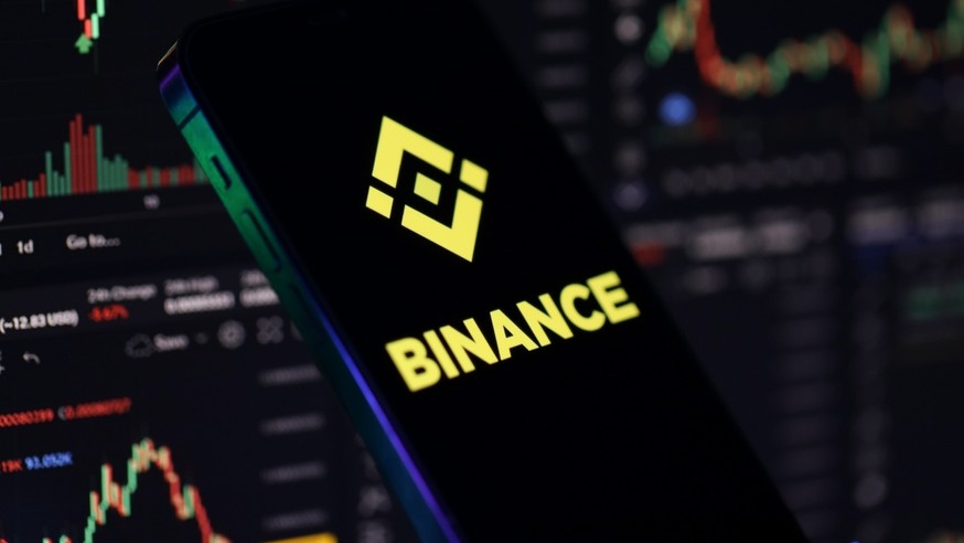 Binance logo on a phone