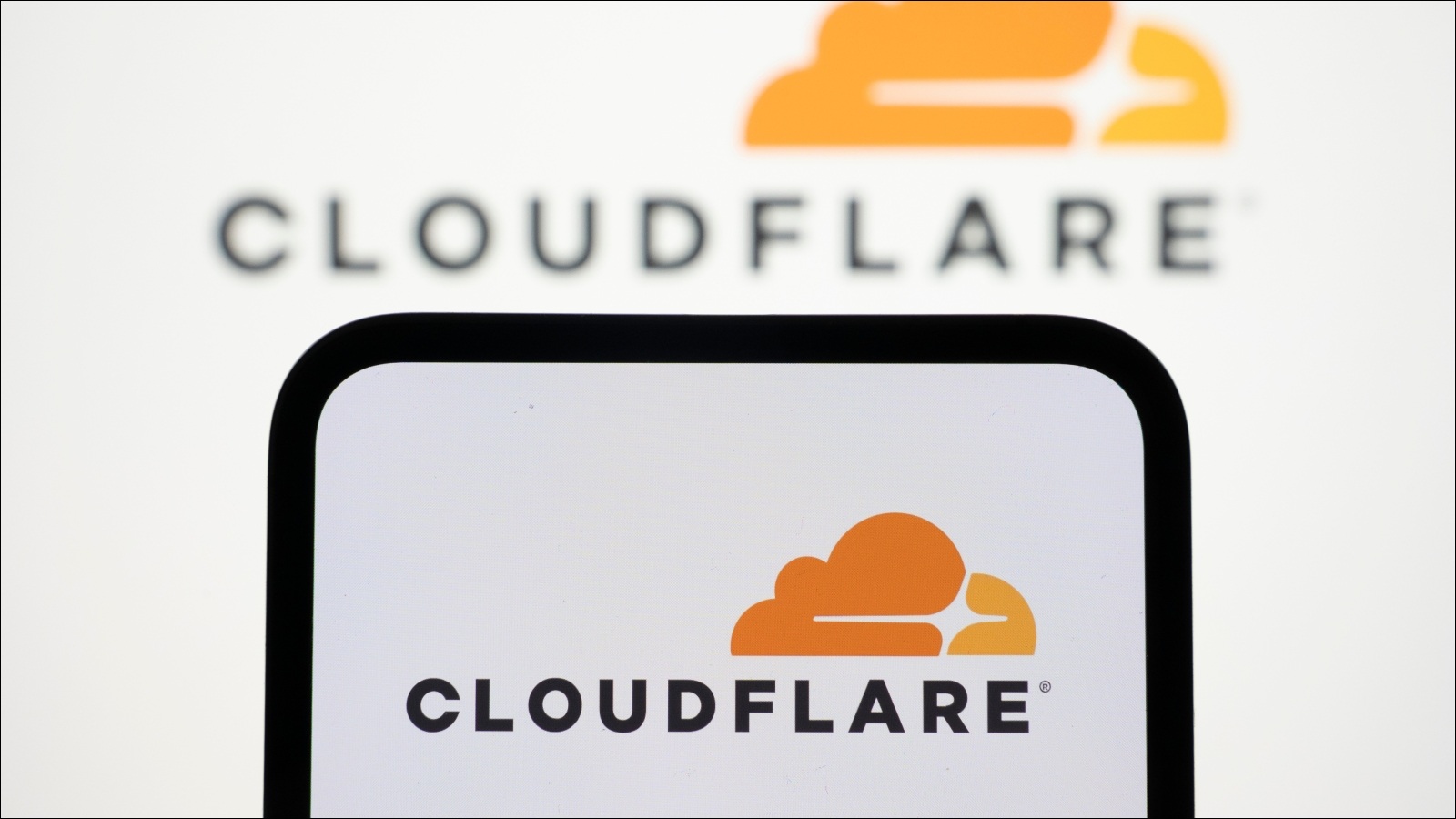 A smartphone showing the Cloudflare logo.