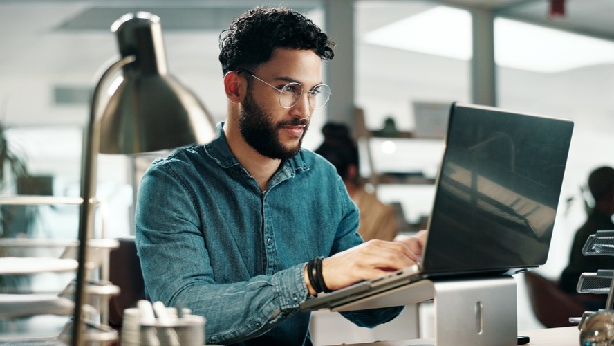 Man working at computer.