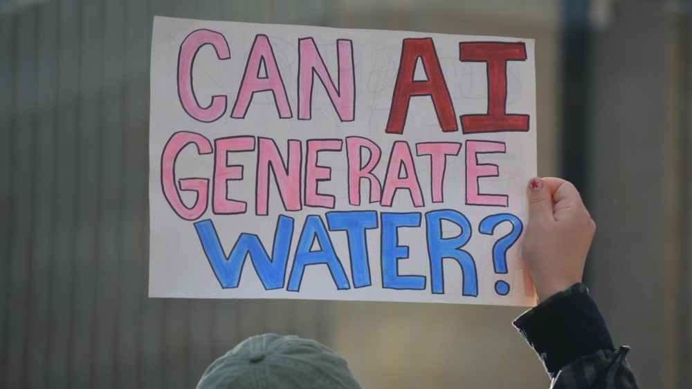 Person holding protest sign.