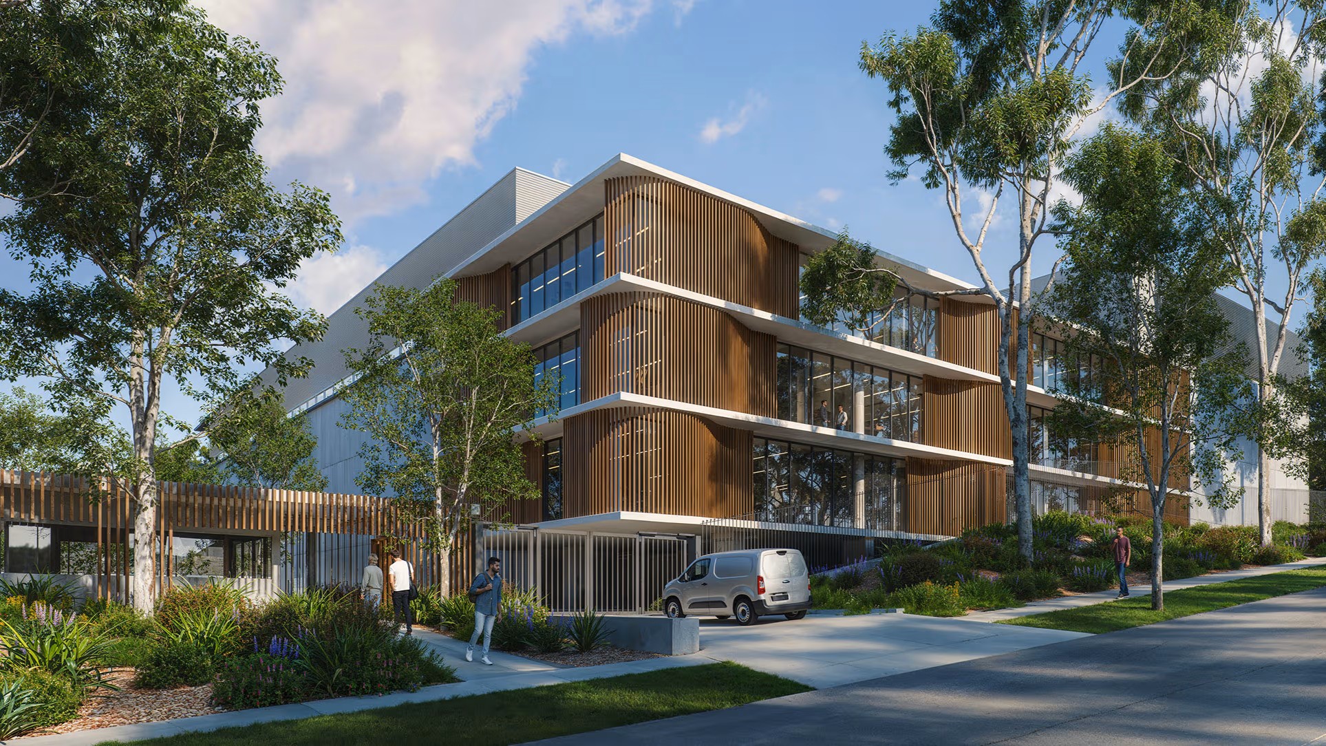 An artist's render of a data centre building surrounded by trees and a road.