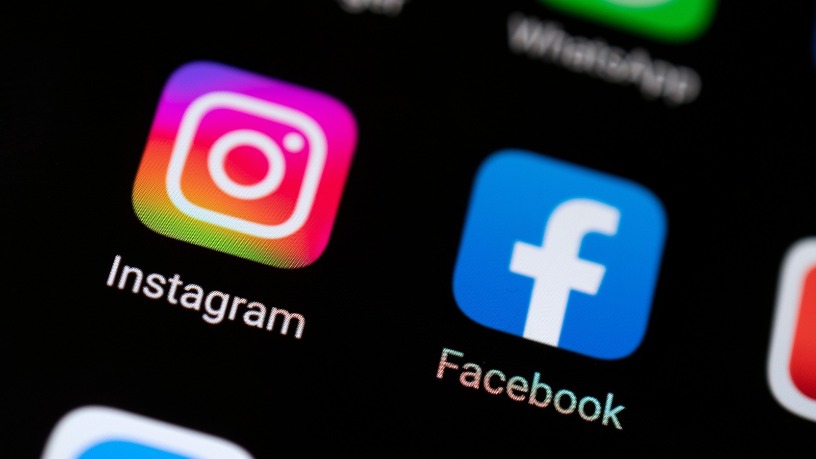 A close up of the Instagram and Facebook app icons on a smartphone screen.