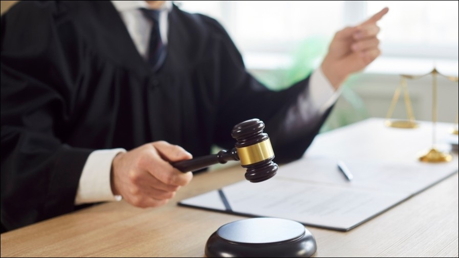 Judge slamming gavel down.